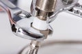 Plumber screwing plumbing fittings Royalty Free Stock Photo