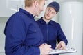 plumber showing pipework to apprentice Royalty Free Stock Photo