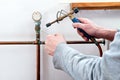 Plumber soldering pipe Royalty Free Stock Photo