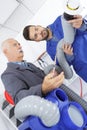 Plumber testing compressor leaks Royalty Free Stock Photo