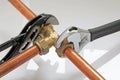 Plumber tightening up pipework Royalty Free Stock Photo