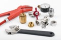 Plumber tools and accessories on white