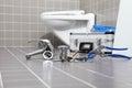 plumber tools and equipment in a bathroom, plumbing repair service, assemble and install concept