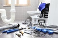 plumber tools and equipment in a bathroom, plumbing repair service, assemble and install concept