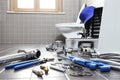 Plumber tools and equipment in a bathroom, plumbing repair servi Royalty Free Stock Photo