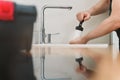 Plumber unclogging kitchen sink Royalty Free Stock Photo