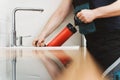 Plumber unclogging kitchen sink Royalty Free Stock Photo