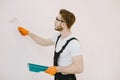 Plumber in uniform on white background