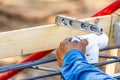 Plumber Using Level While Installing PVC Pipe At Construction Site Royalty Free Stock Photo
