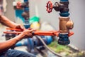 Plumber using a wrench to repair and remove the water supply pipe and valve Royalty Free Stock Photo