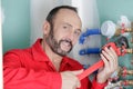 plumber using wrench on water pipe Royalty Free Stock Photo