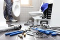 Hands plumber at work in a bathroom, plumbing repair service, as Royalty Free Stock Photo