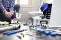 Plumber at work in a bathroom, plumbing repair service, assemble Royalty Free Stock Photo