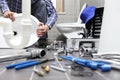 Plumber at work in a bathroom, plumbing repair service, assemble Royalty Free Stock Photo