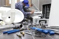 Plumber at work in a bathroom, plumbing repair service, assemble Royalty Free Stock Photo