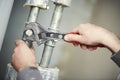 Plumber work. hand with wrench Royalty Free Stock Photo