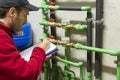 Plumber at work making the consumption metering Royalty Free Stock Photo