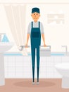 Plumber worker cartoon character. Male character standing in bathroom holding tool box and plumber wrench. Vector Royalty Free Stock Photo