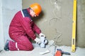 Plumber worker installing sewage pipes in sewerage system