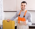 Plumber working at home of client Royalty Free Stock Photo