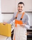 Plumber working at home of client Royalty Free Stock Photo