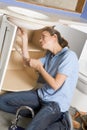 Plumber working on sink