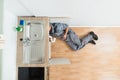 Plumber Working Under Kitchen Sink Royalty Free Stock Photo