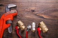 Plumbers fixtures with red handles and monkey Royalty Free Stock Photo