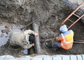 Plumbers repairing water pipe