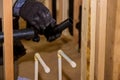 Plumbing building contractor installing plastic drain pipe in the elbow for sink drain for a custom house Royalty Free Stock Photo