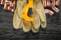 Plumbing copper water pipe scissors leather safety gloves on woo