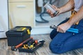 Plumbing done right. Cropped shot of professional plumber using pipe wrench and other tools while fixing sink pipe in Royalty Free Stock Photo