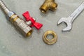 Plumbing faucet and a wrench in water drops during equipment repair during an accident Royalty Free Stock Photo
