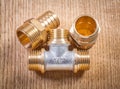 Plumbing fixtures on wooden board Royalty Free Stock Photo