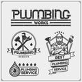 Plumbing and home renovation services emblems with working tools. Logos template and design elements. Royalty Free Stock Photo