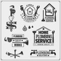 Plumbing and home renovation services emblems with working tools. Logos template and design elements. Royalty Free Stock Photo