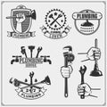 Plumbing and home renovation services emblems with working tools. Logos template and design elements. Royalty Free Stock Photo