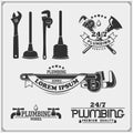 Plumbing and home renovation services emblems with working tools. Logos template and design elements. Royalty Free Stock Photo