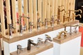 Plumbing and kitchen faucets at exhibition in store Royalty Free Stock Photo