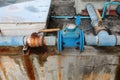 Plumbing main tube and water leak, old tap pipe steel rust Royalty Free Stock Photo