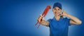 Plumbing services - woman plumber with wrench showing phone call gesture on blue background with copy space Royalty Free Stock Photo