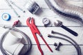 Plumbing tools and accessories on wooden table. top view Royalty Free Stock Photo