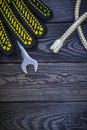 Plumbing tools for connecting water hoses on a black wooden background Royalty Free Stock Photo