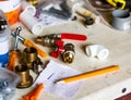 Plumbing tools, screws and pipes on a working desk