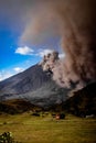 Plume of smoke billows from the active and destructive volcano at Batangan Royalty Free Stock Photo