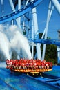 A plume of water rises from a thrill ride Royalty Free Stock Photo