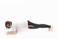 Plump girl goes in for sports. Woman with curvy figure stands in plank. Sports motivation and healthy lifestyle