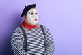 Plump pensive thoughtful clown looking up , whistling . Royalty Free Stock Photo