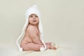 Plump satisfied child in a white hat Royalty Free Stock Photo