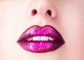 Plump sexy full lips. Purple lipstick. Perfect natural lip makeup. Close-up beautiful lips. Sexy plump lips nude Royalty Free Stock Photo